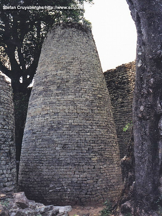 Great Zimbabwe - Tower We also visit the great enclosure; an immense stone wall with the famous conical tower in the middle. This was the place of residence of the queens. Stefan Cruysberghs